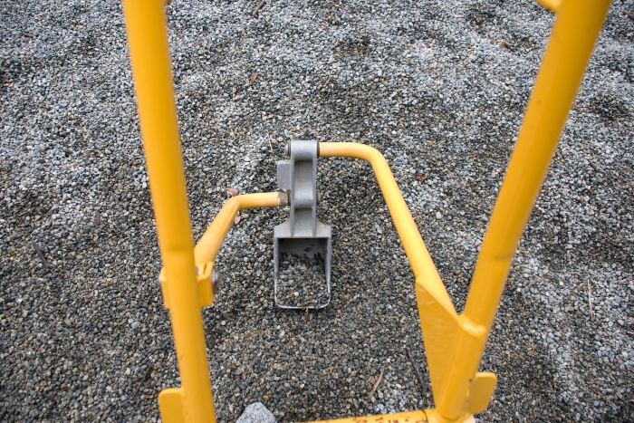 Pea gravel on playground floor with toy crane